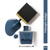 Midnight Indigo matte nail polish bottle with applicator and packaging on a clean white background