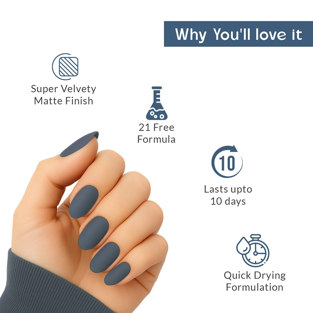Hand with midnight indigo matte nail polish showcasing product features on a clean white background